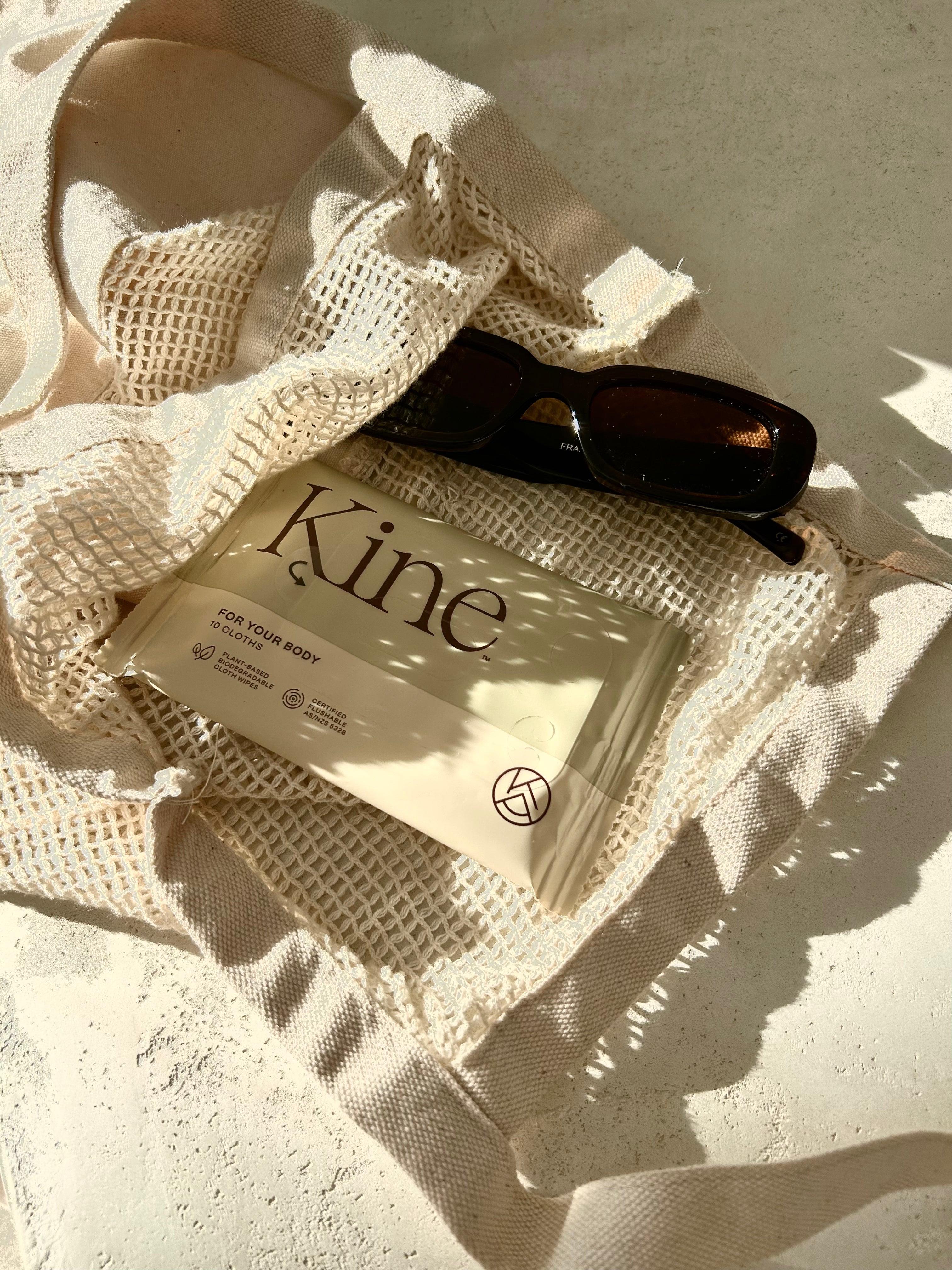 Kine product packaging on a textured fabric surface